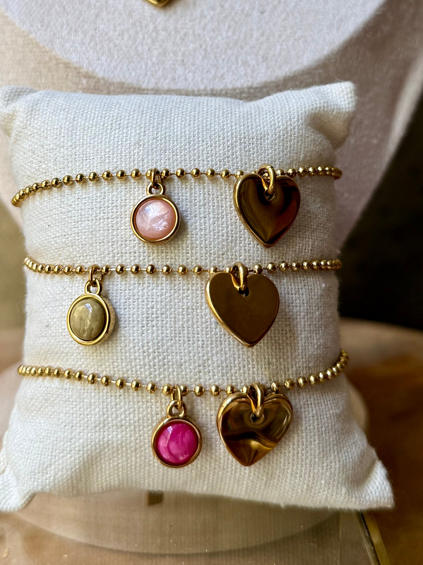 Qoss armband of ketting met hartje