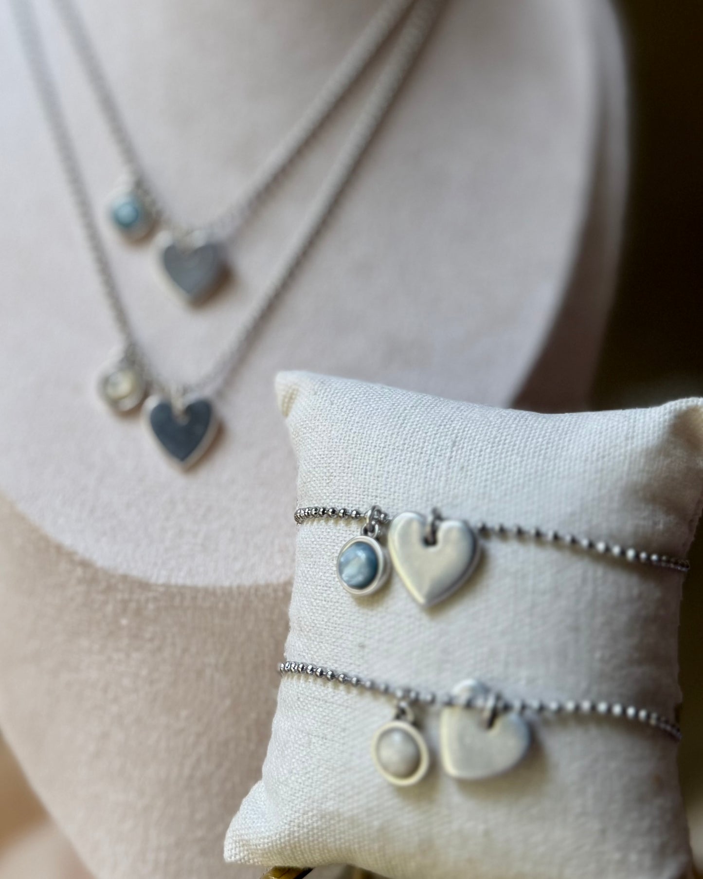 Qoss armband of ketting met hartje