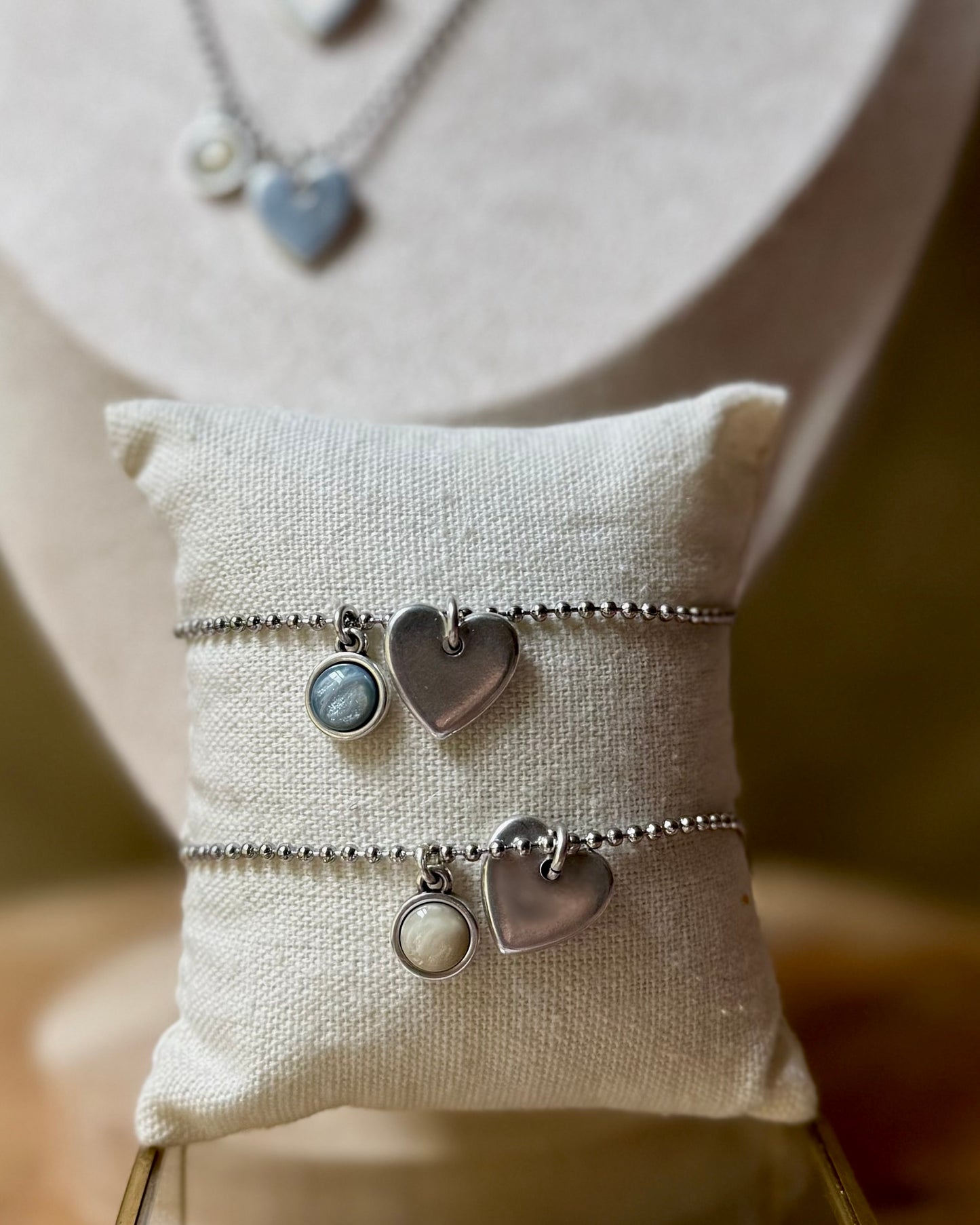 Qoss armband of ketting met hartje
