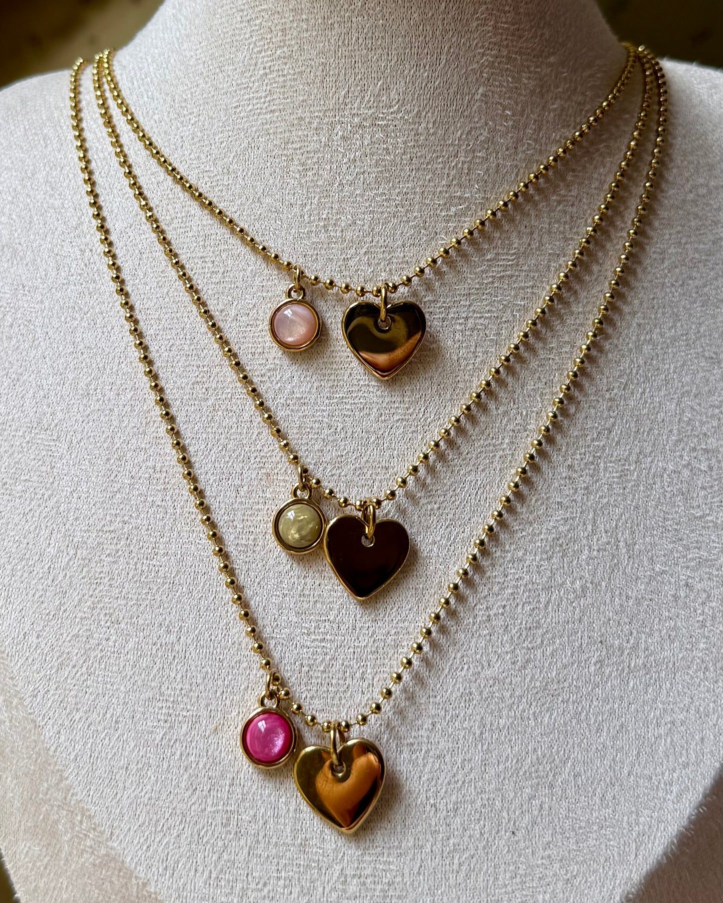 Qoss armband of ketting met hartje