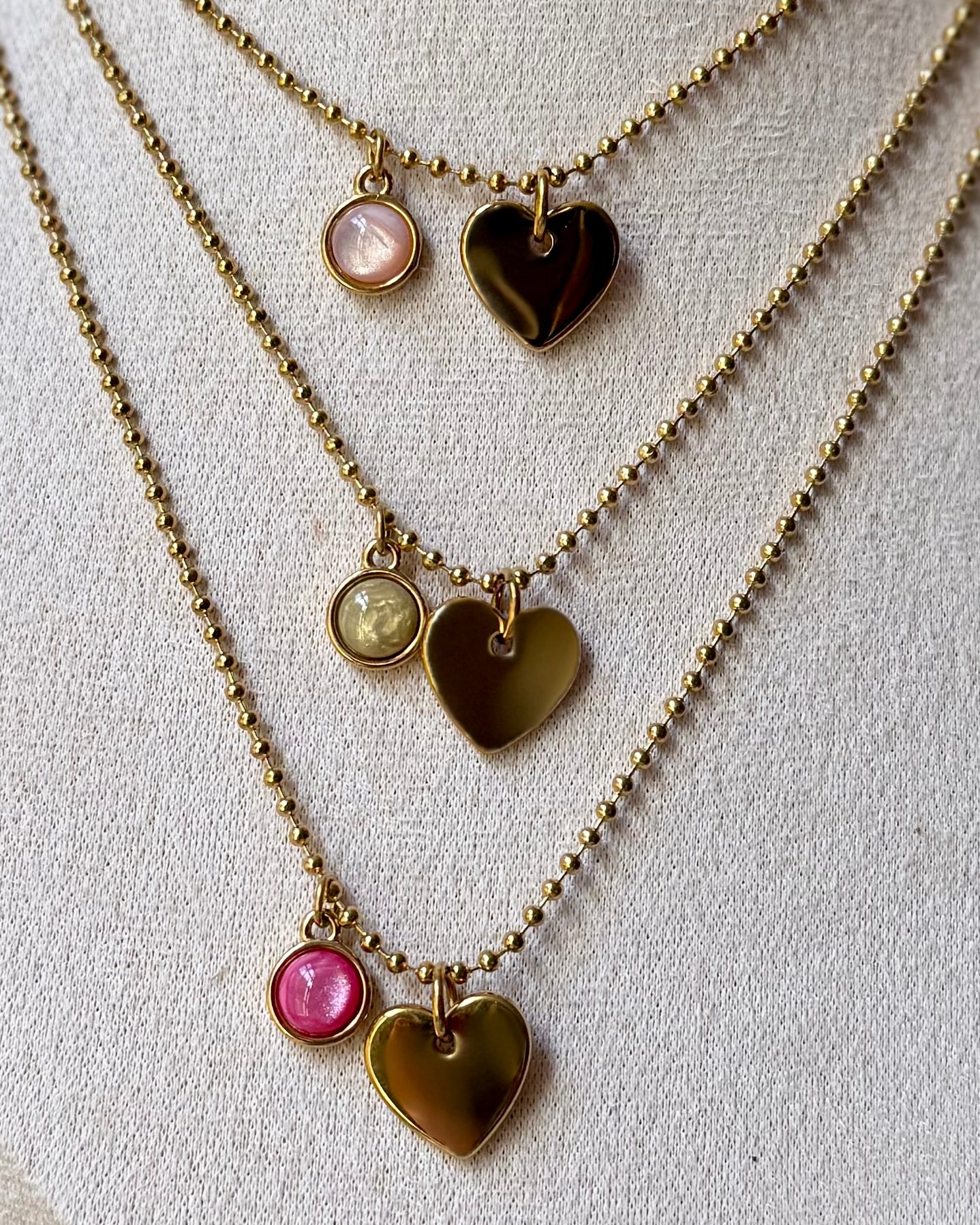 Qoss armband of ketting met hartje
