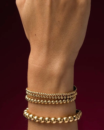 Tijdloze armband met goudkleurige kralen