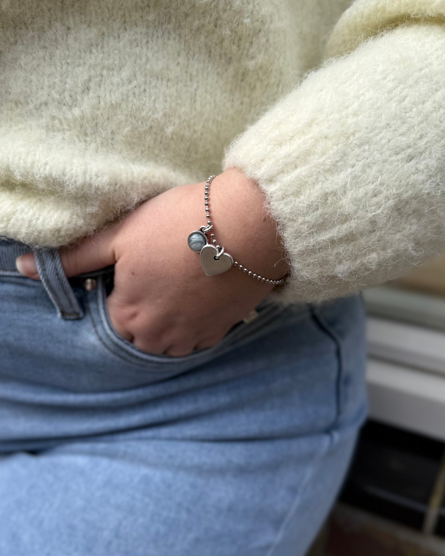 Qoss armband of ketting met hartje