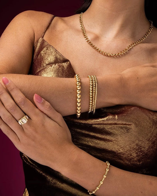 Tijdloze armband met goudkleurige kralen