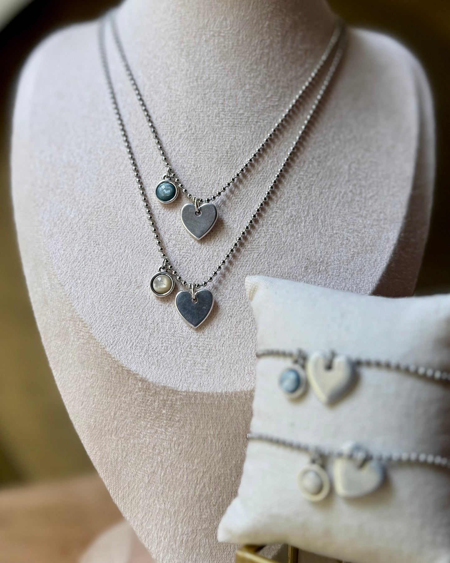 Qoss armband of ketting met hartje
